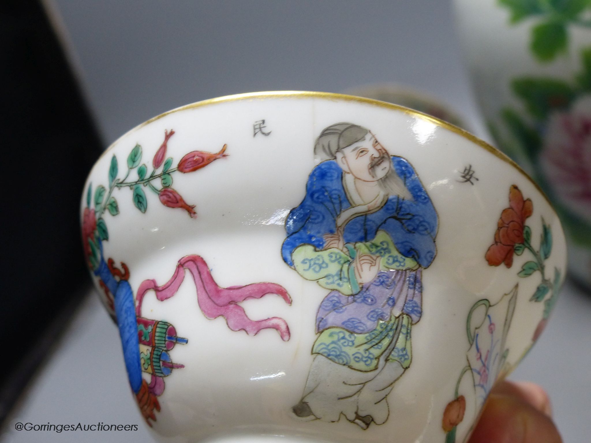 A 19th century famille rose bowl and stand, a blue and white cup, a famille rose jar and a stone carving of two monkeys